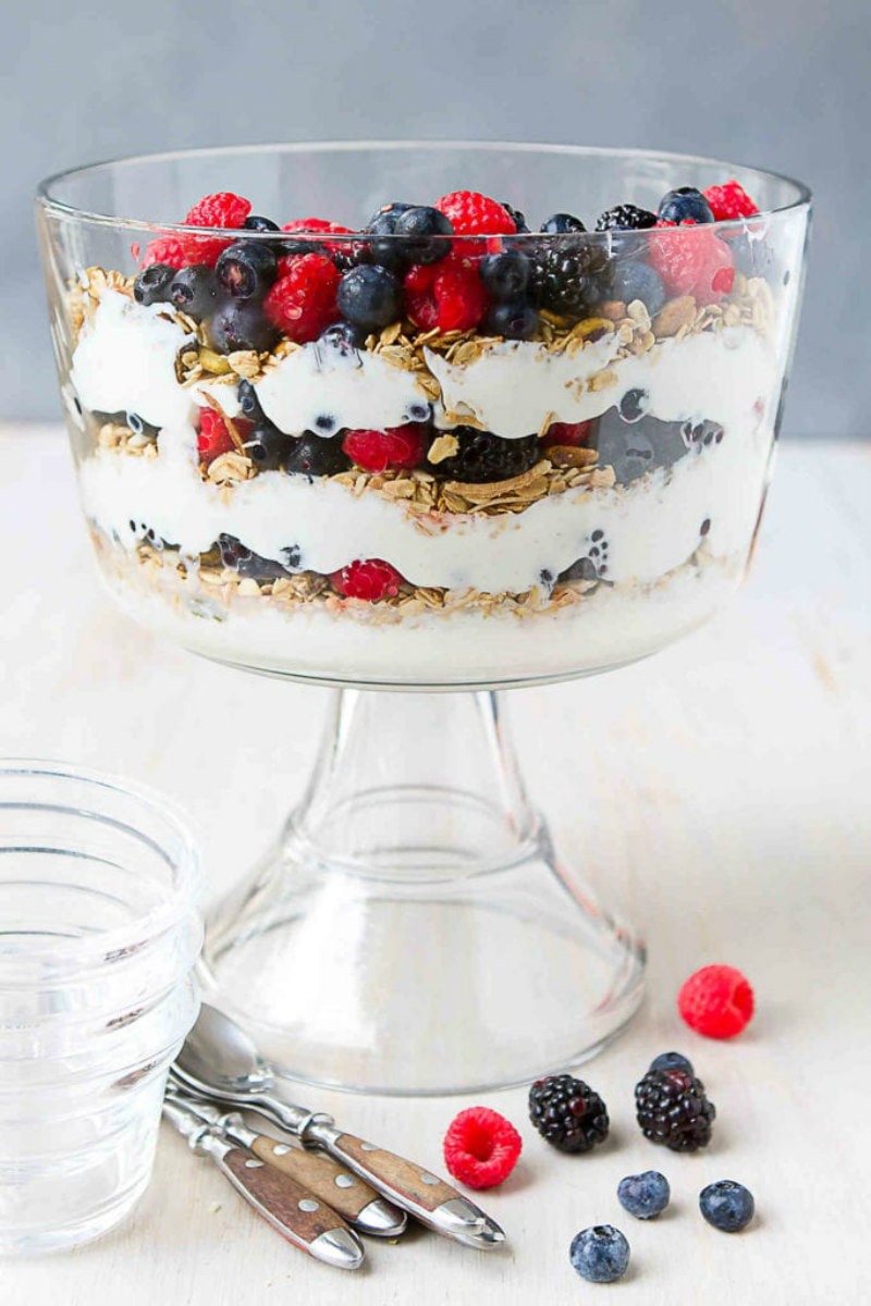 trifle dish with berry yogurt parfait inside