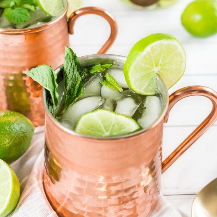 champagne moscow mules garnished with mint and lime