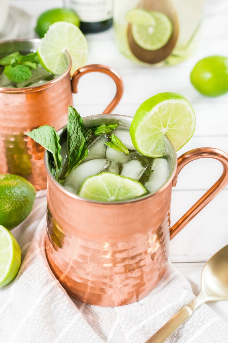 champagne moscow mules garnished with mint and lime