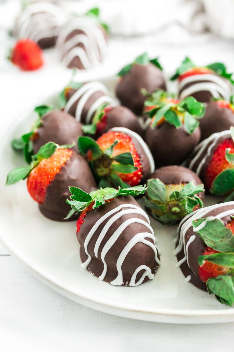 chocolate covered strawberries on a white plate