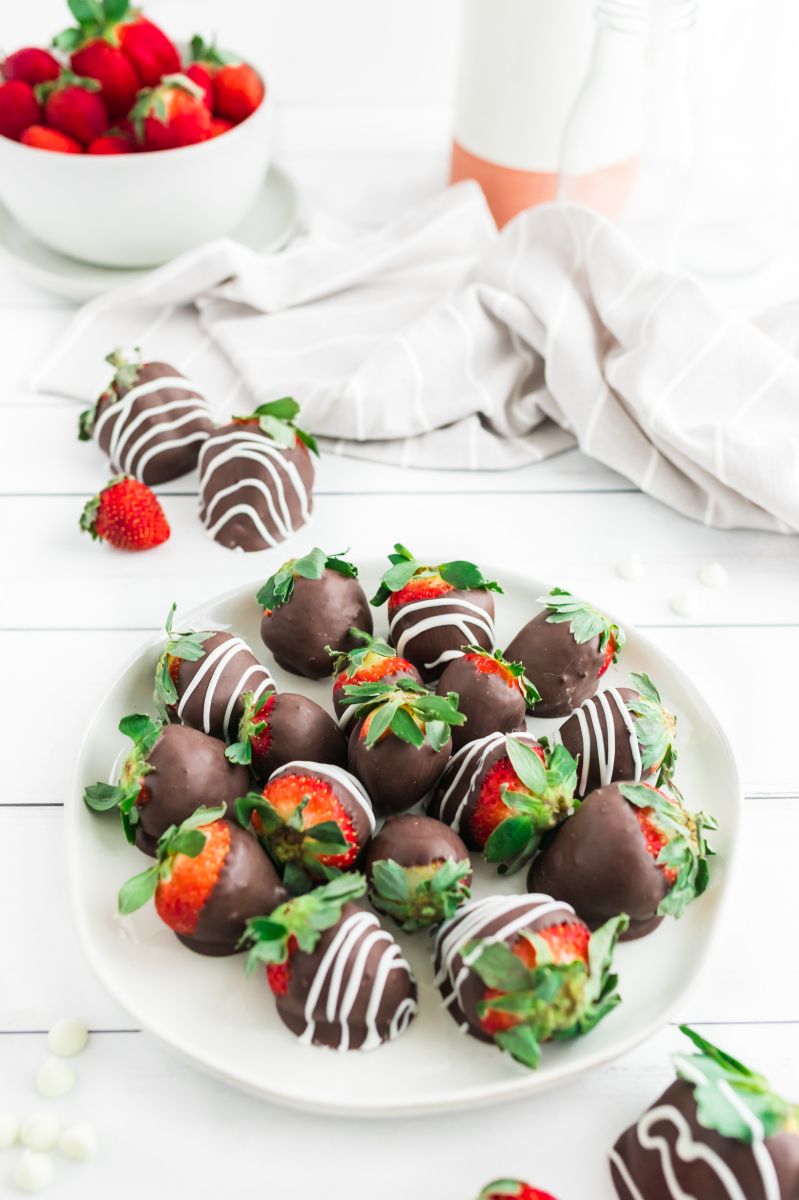 chocolate covered strawberries displayed on white plate