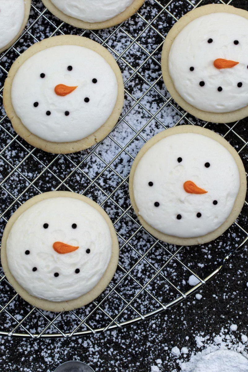 snowman sugar cookies on a cooling rack