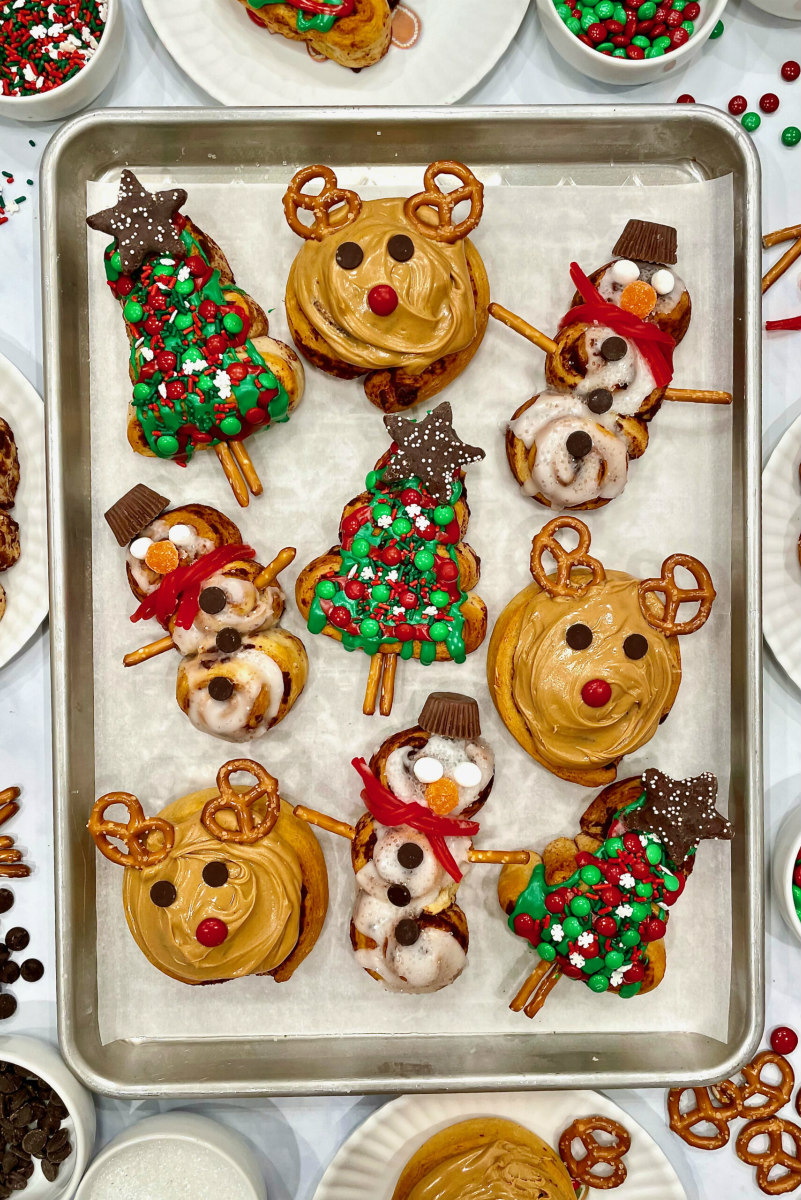 cinnamon rolls decorated as christmas shapes