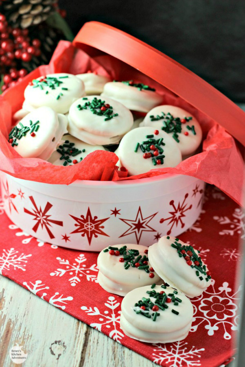 tin full of white chocolate covered gingerbread oreos