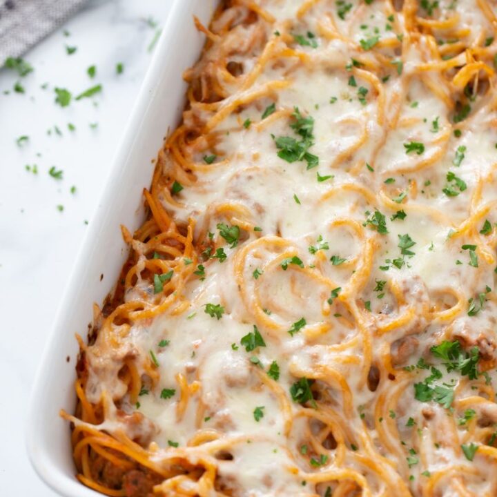 Baked Spaghetti Casserole in white baking dish