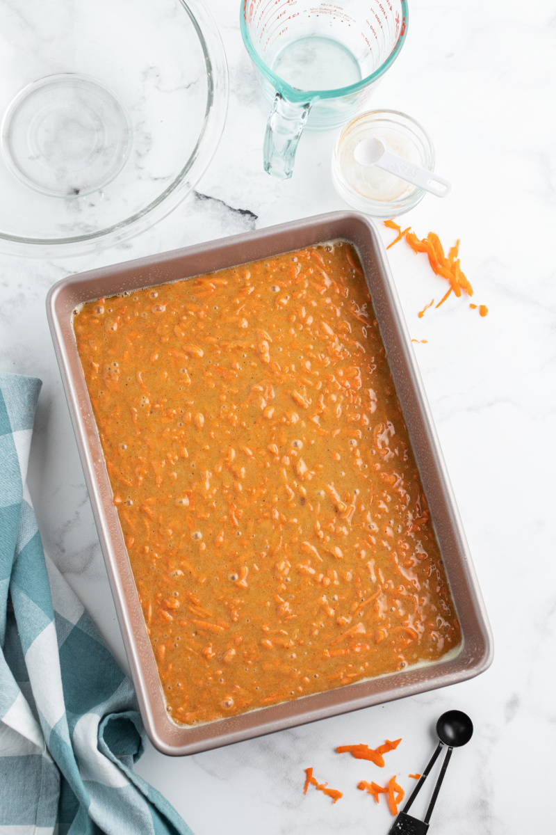 carrot sheet cake in a pan ready for oven