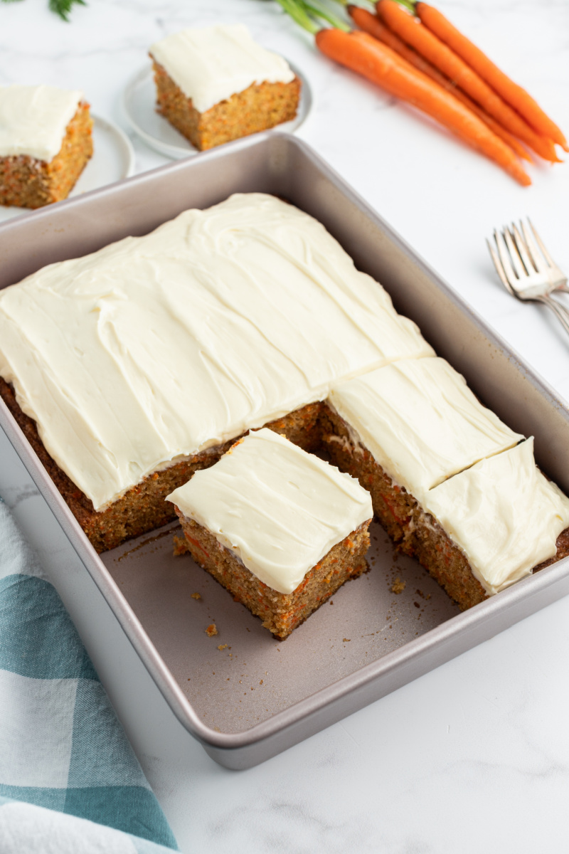 carrot cake in a pan with cream cheese frosting