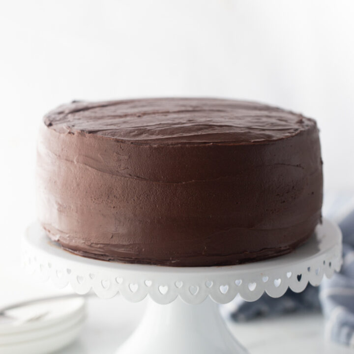 chocolate cake on a white cake stand