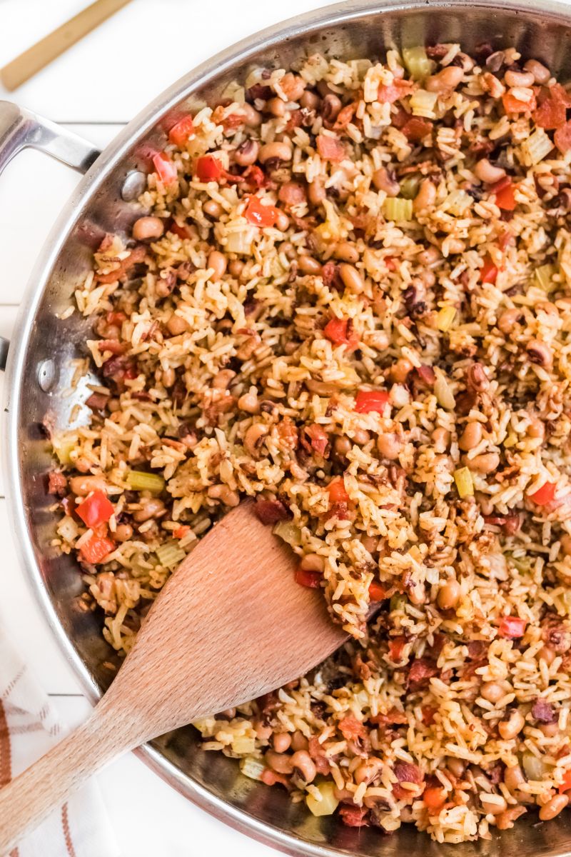 hoppin john in skillet with wooden spoon