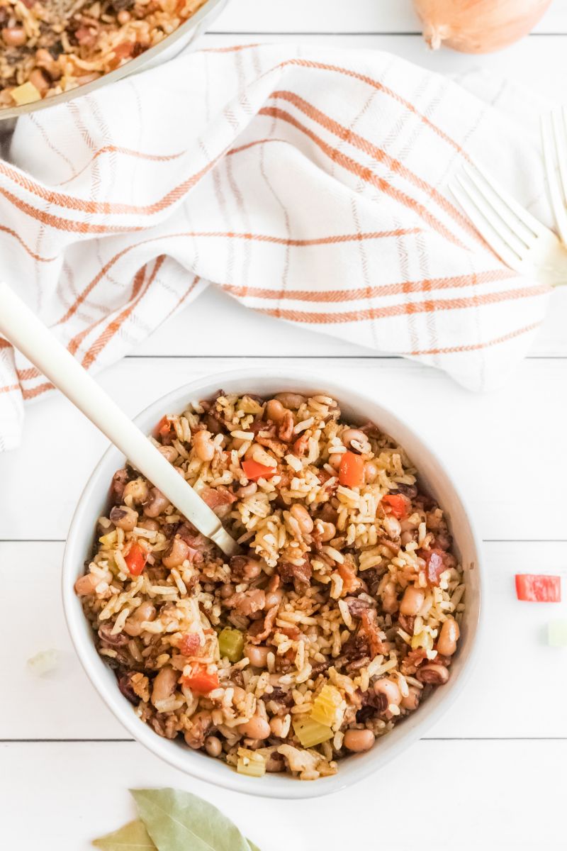 hoppin john in white bowl with spoon