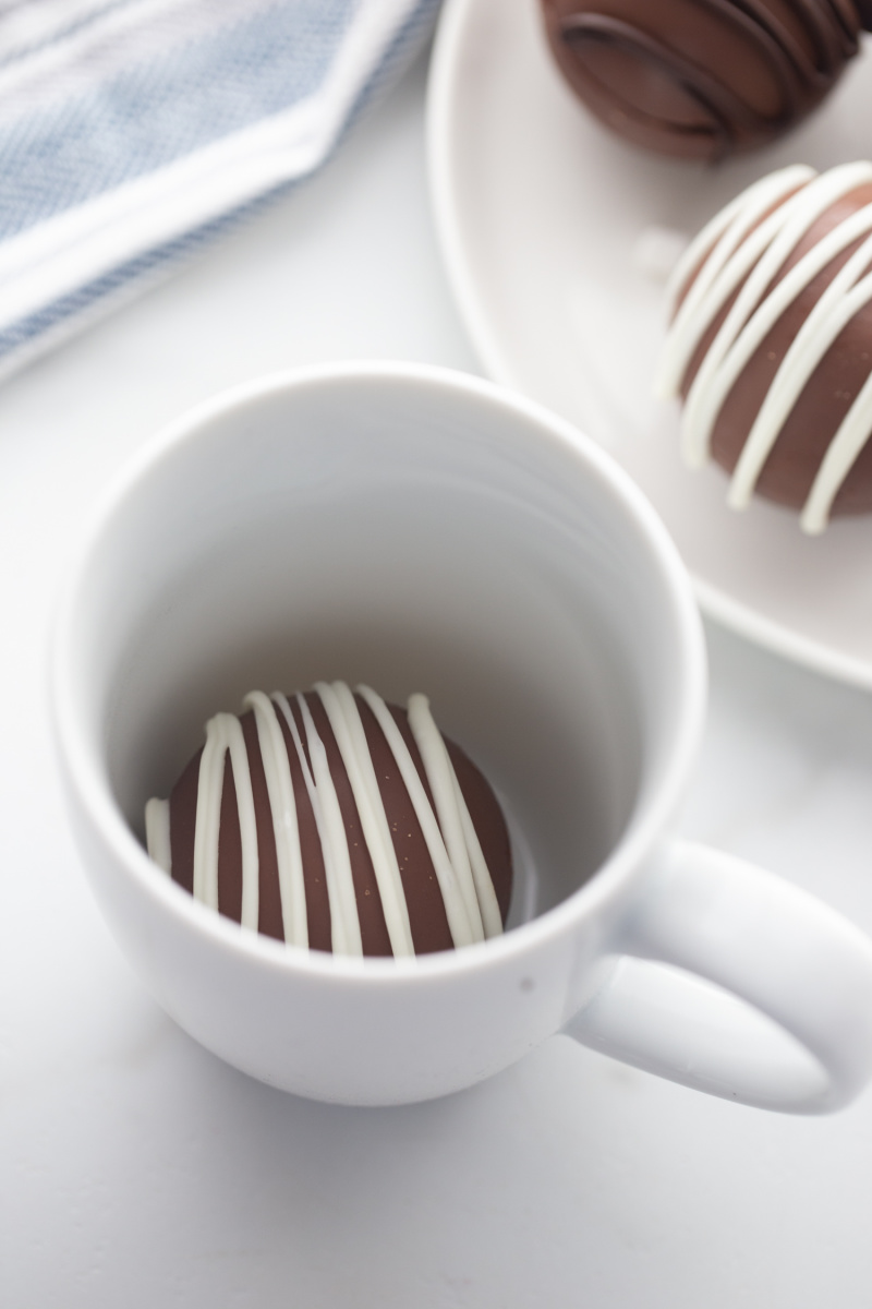hot chocolate bomb in white mug