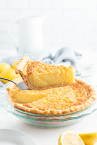 serving taking slice out of lemon chess pie