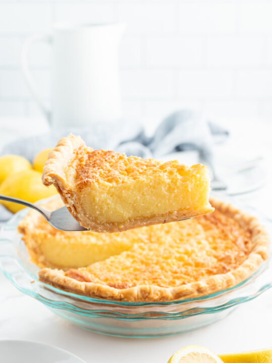 serving taking slice out of lemon chess pie
