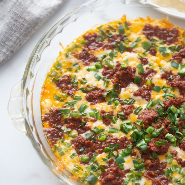 queso fundido in a glass baking dish