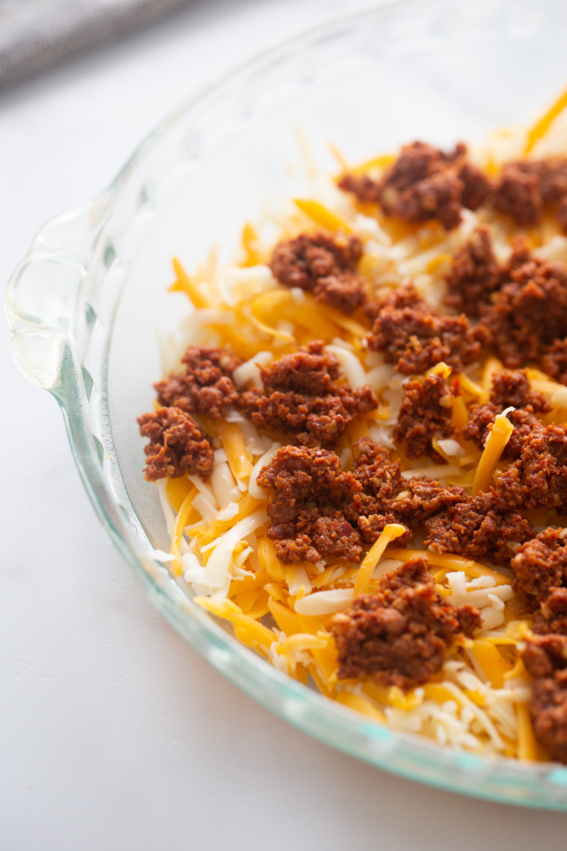 cheese and chorizo in a dish