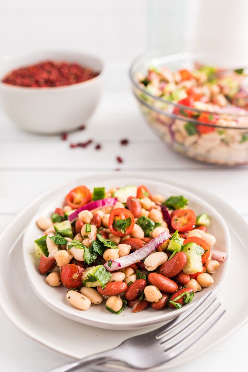 serving of three bean salad on a white plate