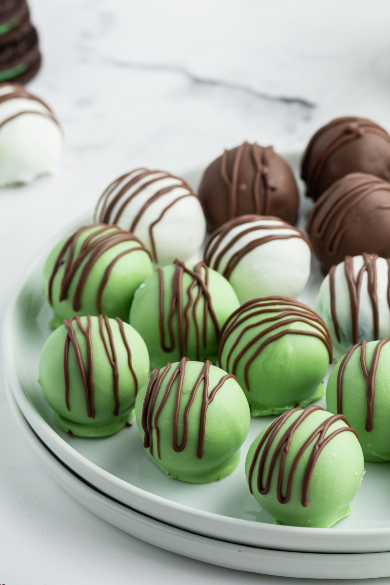 chocolate mint oreo truffles on a white plate