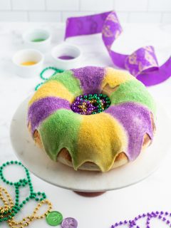 king cake with glaze and colored sugars