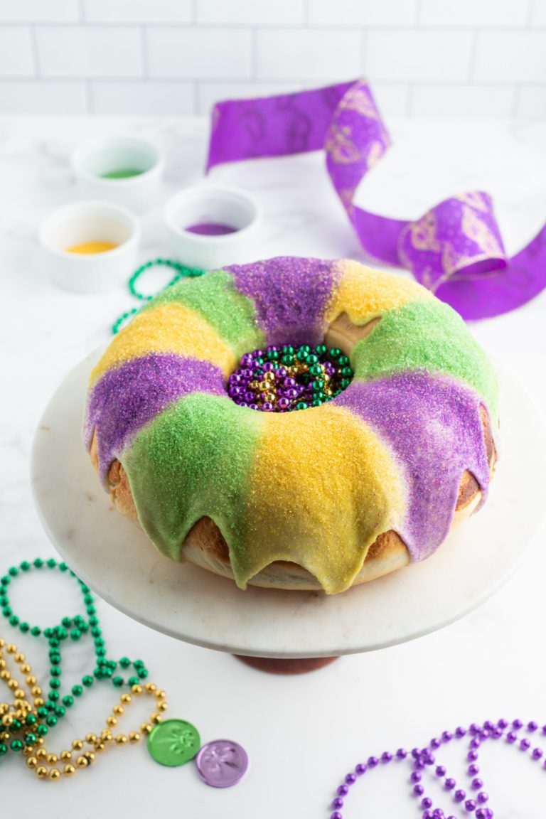 king cake with glaze and colored sugars