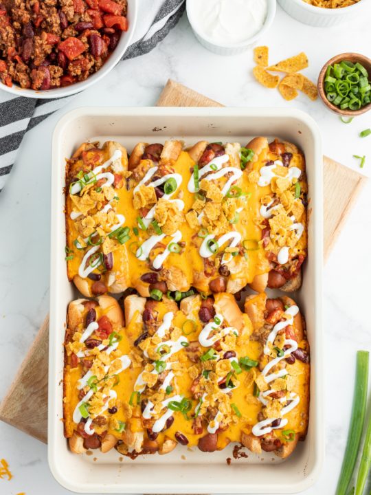 baked chili dogs in white casserole dish