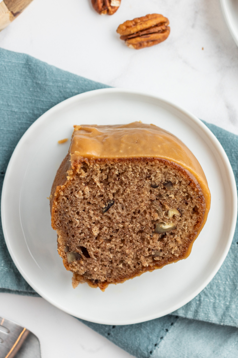 slice of caramel cinnamon roll bundt cake on white plate