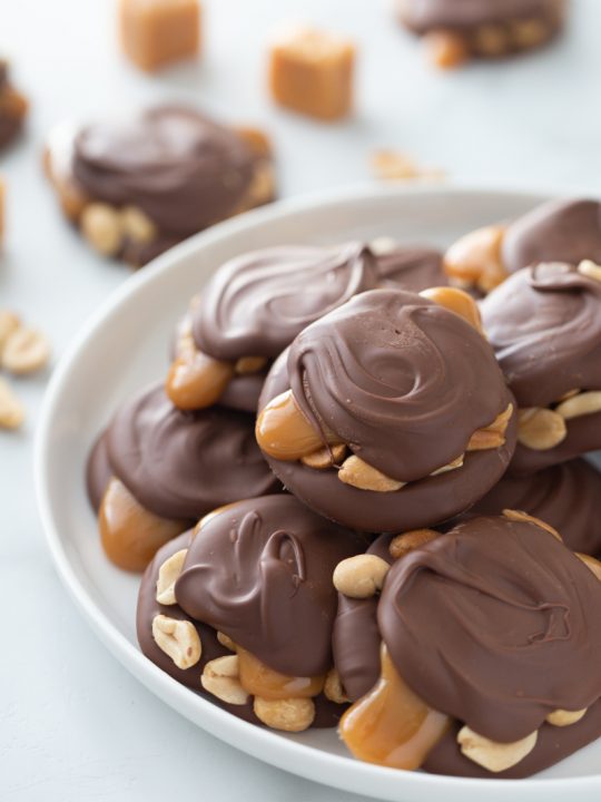 caramel peanut clusters on a serving platter