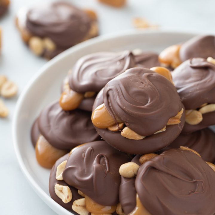 caramel peanut clusters on a serving platter