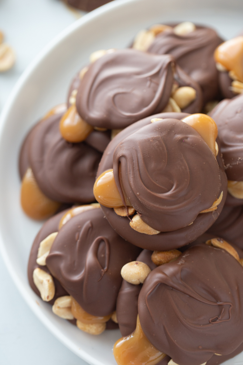 caramel peanut clusters on a serving platter