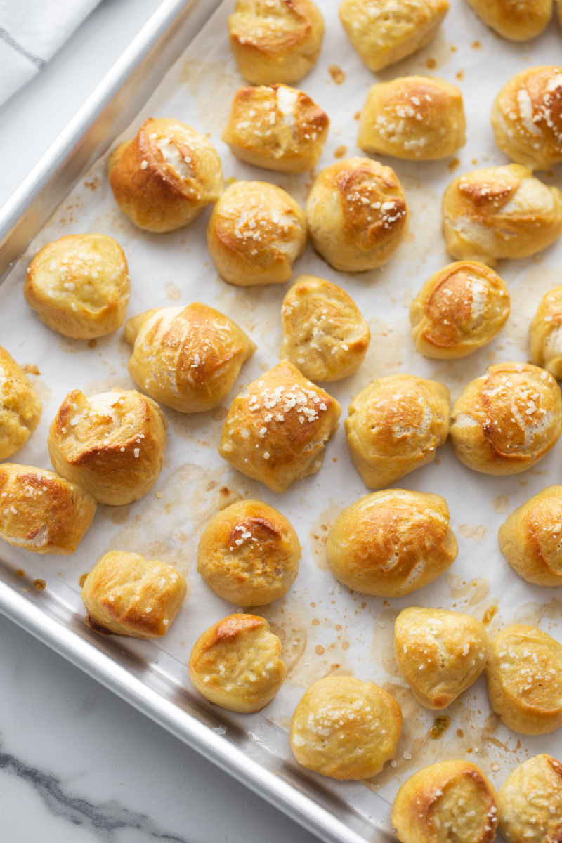 soft pretzel bites on a baking sheet just out of the oven