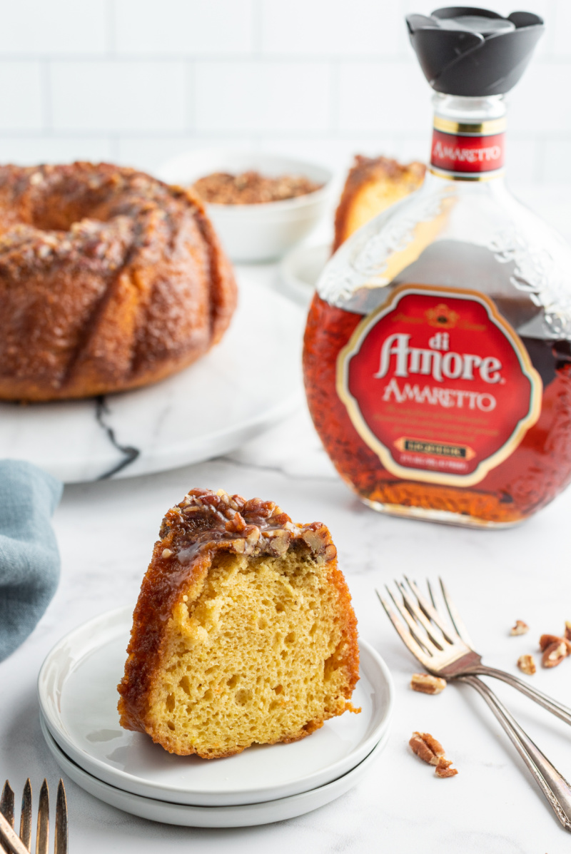 slice of amaretto bundt cake on a white plate