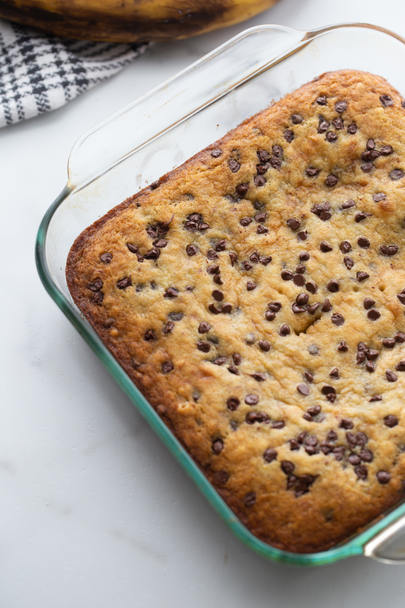 chocolate chip banana snack cake baked in pyrex pan