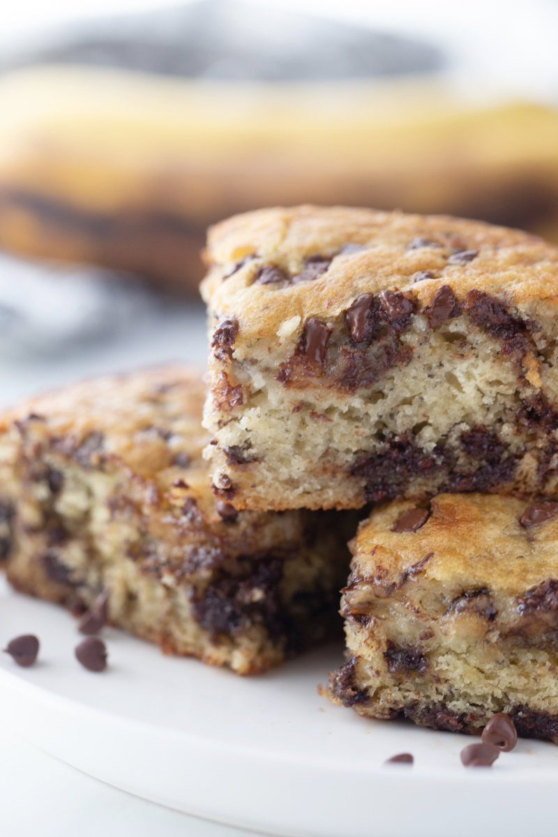 three pieces of banana chocolate chip snack cake stacked on platter