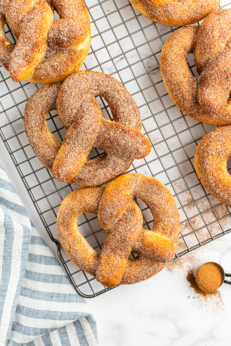 cinnamon sugar soft pretzels on a cooling rack