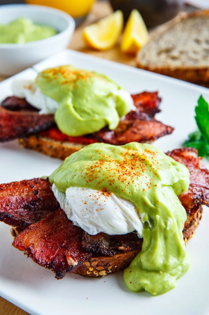 bacon eggs benedict with avocado hollandaise sauce