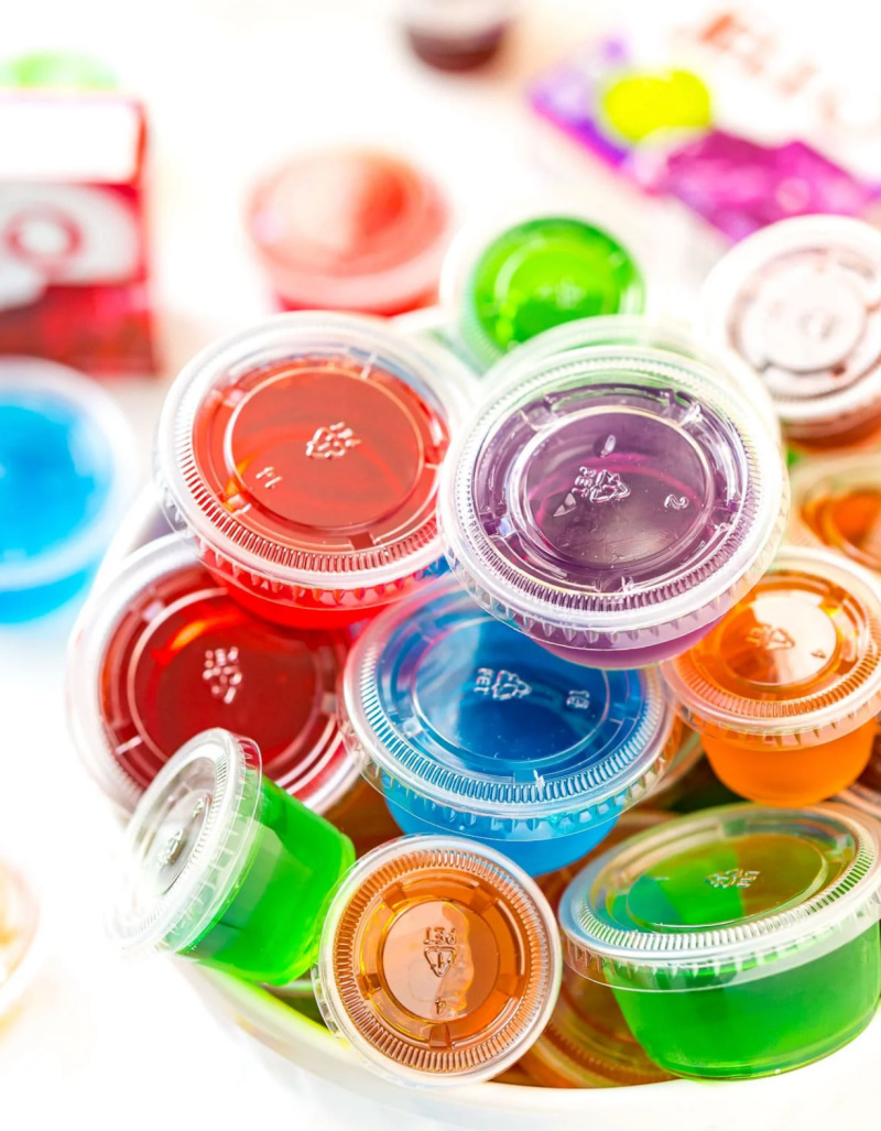 Jello shots in plastic cups stacked