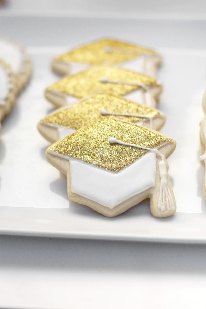 Graduation Hat Cookies on white platter