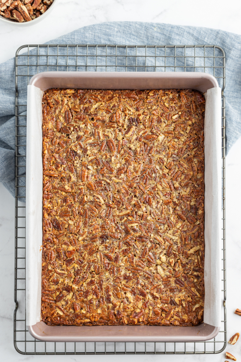 pecan pie bars in pan before cutting