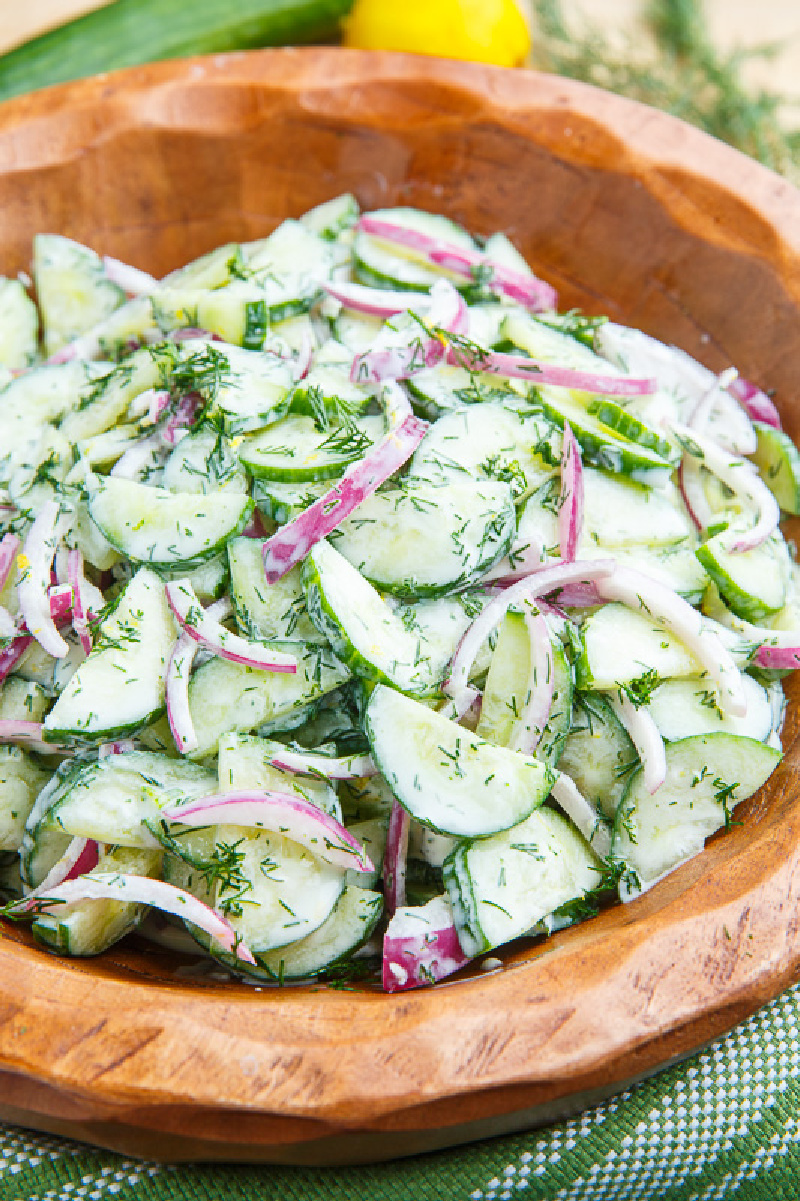 creamy cucumber salad in orange bowl