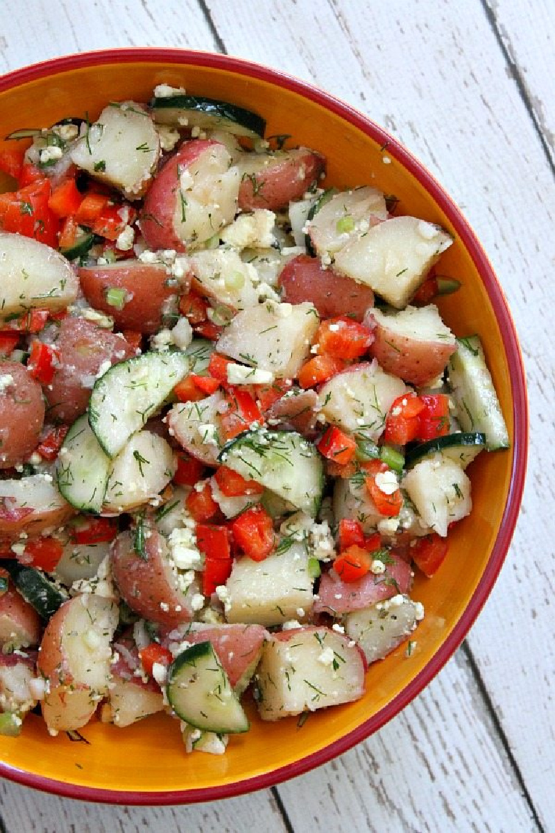 dill potato salad in orange bowl