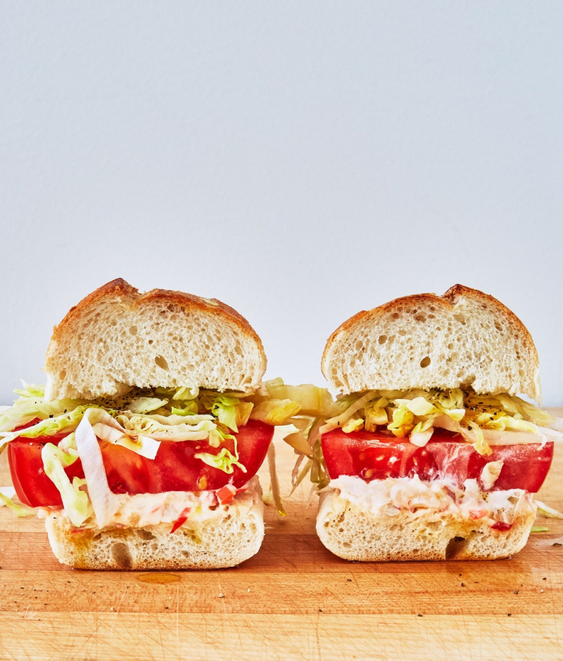 two veggie italian hoagies on cutting board