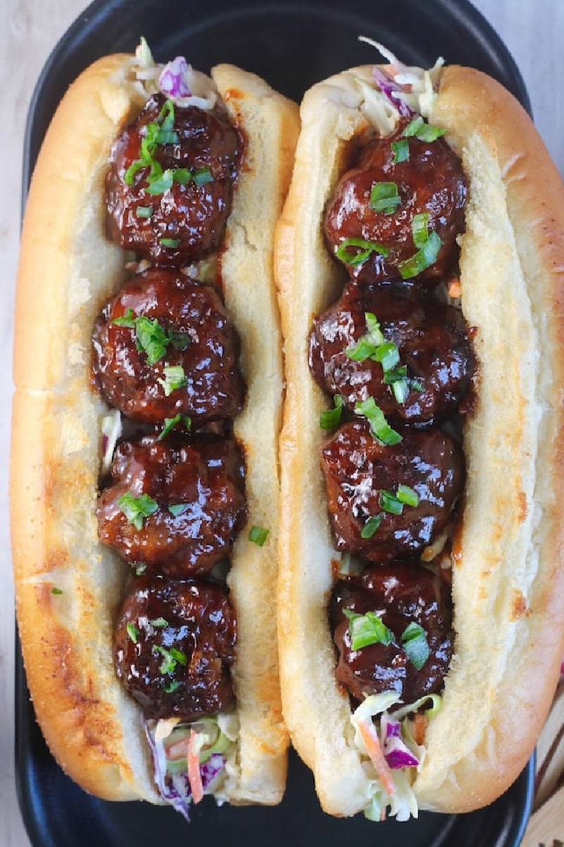 overhead shot of two barbecue meatball hoagies