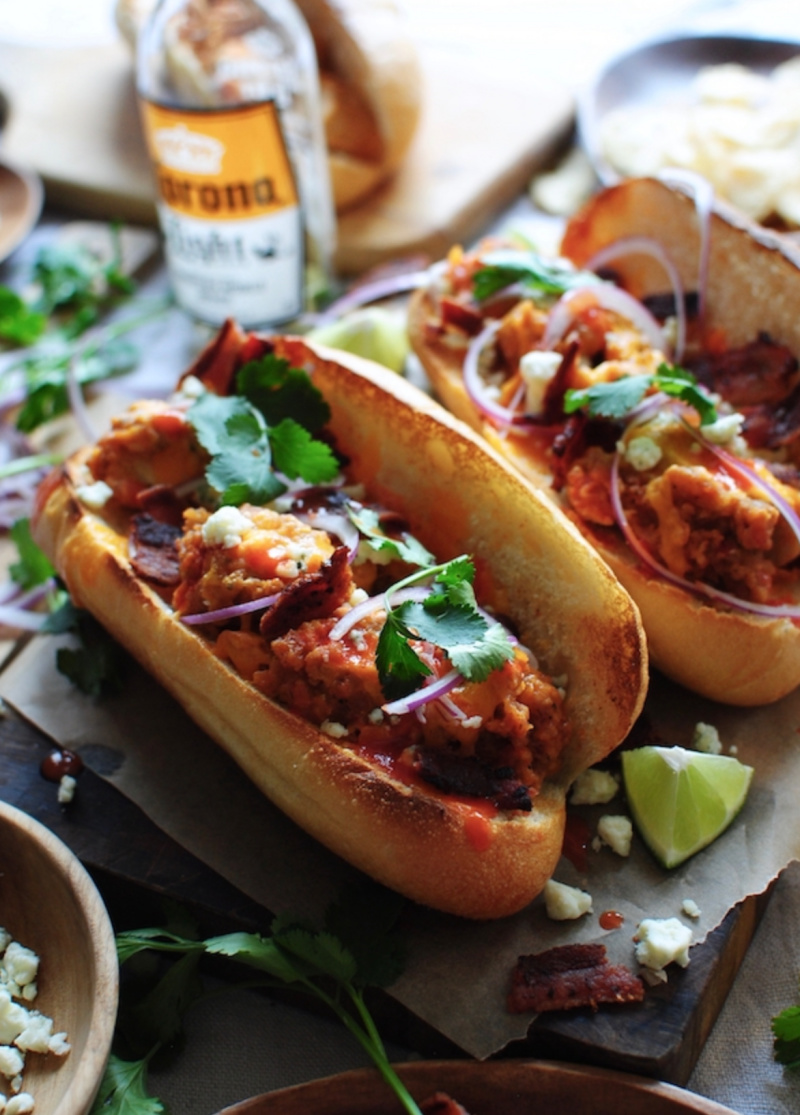 buffalo chicken hoagies displayed with Corona beer in background