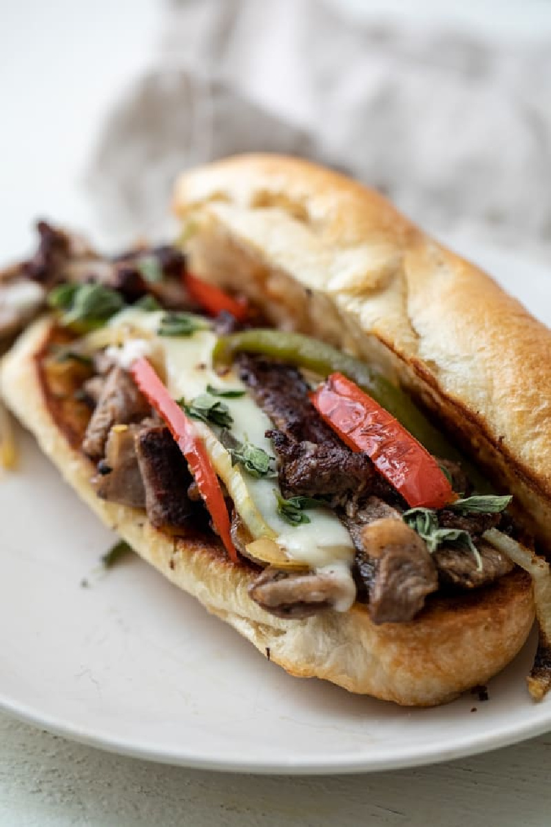 steak hoagie on a white plate