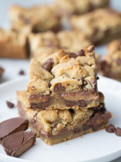 two reeses stuffed chocolate chip cookie bars stacked