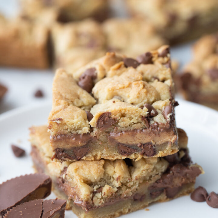 two reeses stuffed chocolate chip cookie bars stacked