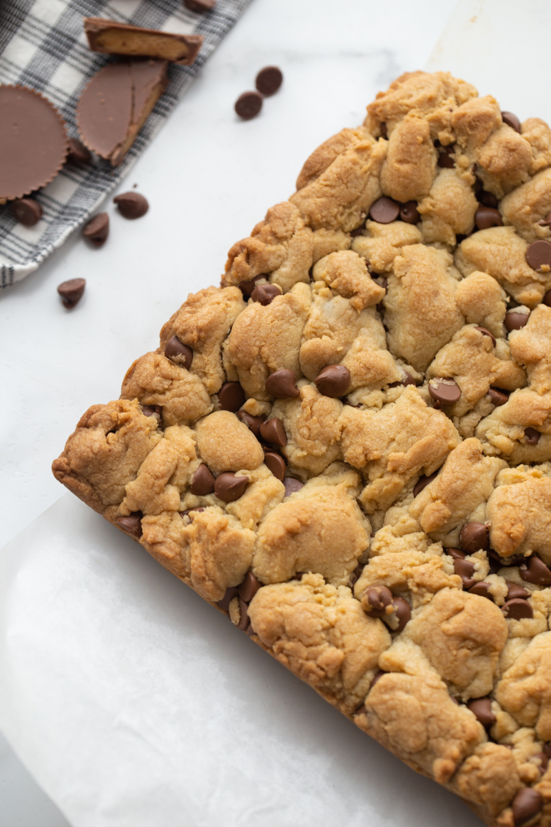 slab of chocolate chip cookie bars before cutting