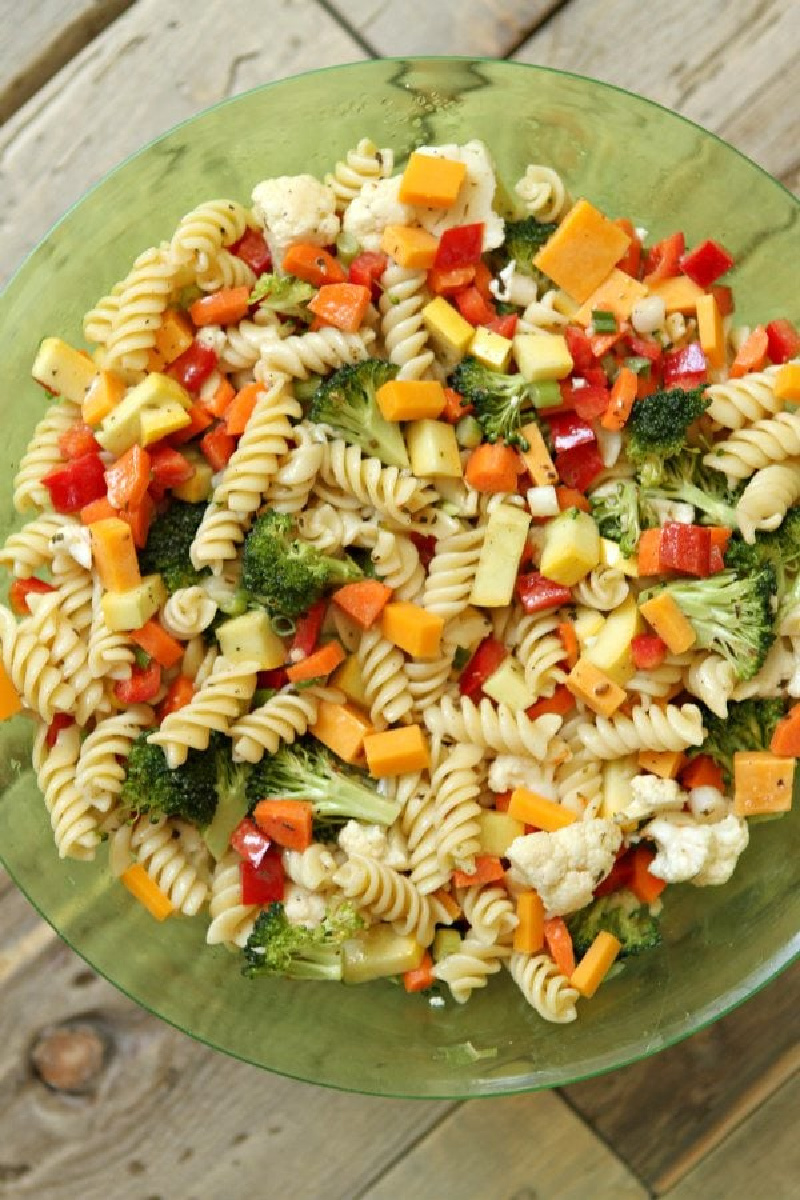 summer veggie pasta salad in green bowl