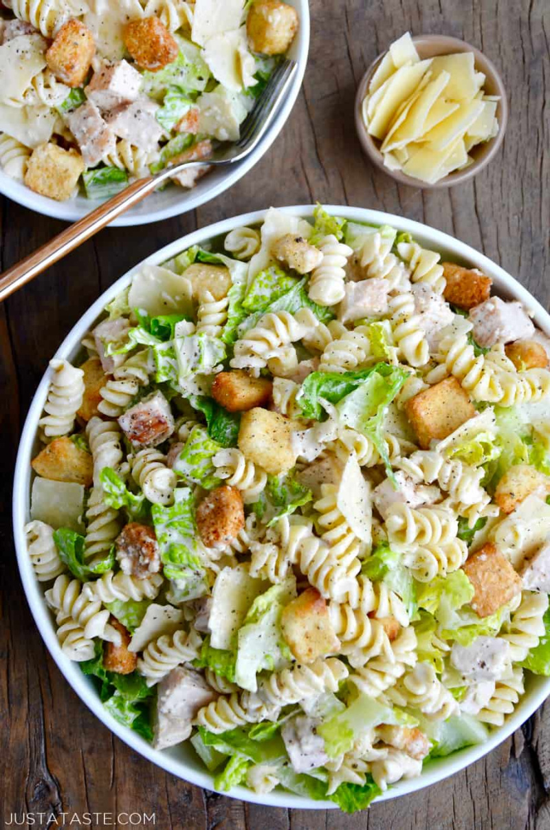 chicken caesar pasta salad in white bowl