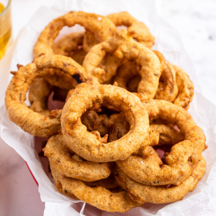 beer battered onion rings in a basket