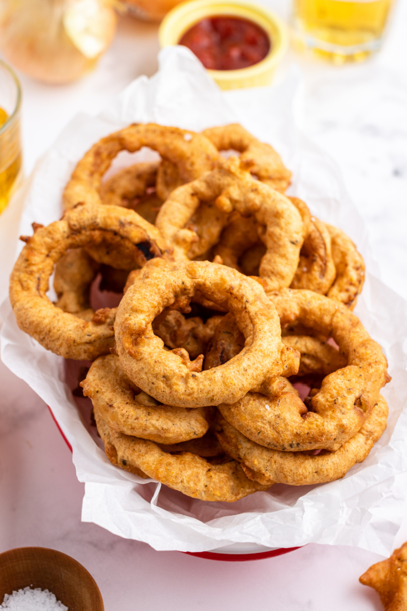 beer battered onion rings in a basket